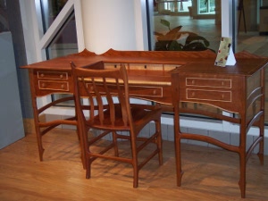 A beautifully hand-crafted cherry and maple desk in the tradition of a secretary desk