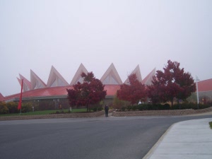 The red-roofed Tamarack building is crowned by a circle of large white triangular points
