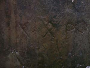 Closeup photo of runes etched in stone, Heavener Runestone State Park, Oklahoma