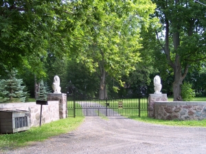 Two lions bearing shields flank the gate to this Montreal estate
