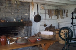 Kitchen implements, a large cooking hearth, cooking implements in a recreated kitchen at the Shelburn Museum.