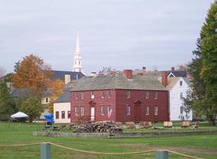 A bright red colonial building dominates the foreground of the Strawbery Banke
museum panorama