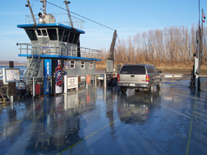 our pickup is the only vehicle on the deck of the barge, next to the little
push boat that sits to one side.