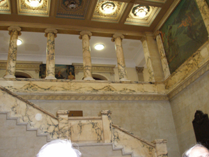 Marble staircase in State House showing balcony with marble columns above