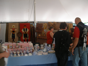 Booth showing china and figurines and tapestries of folk costumes