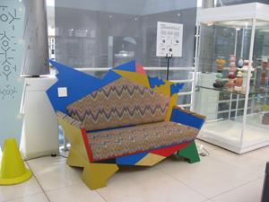 Multicolored sofa, appearing uncomfortable to sit in