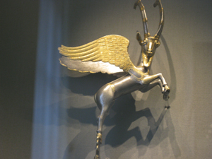 A silver antelope with golden wings