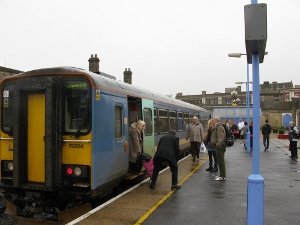 Passengers disembark from the single car train from Norwich to Lowestoft and return.