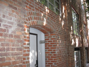 The door of an old brick warehouse