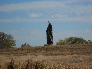 The bronze statue is 22 feet high and depicts Standing Bear in a majestic pose, atop a hill.