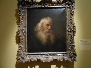 The subject old man is distinguished by long hair and a luxuriant beard; the painting has an ornate frame
