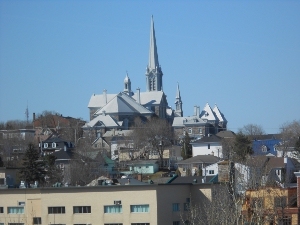 The silver roofed church has many spires rising above the city