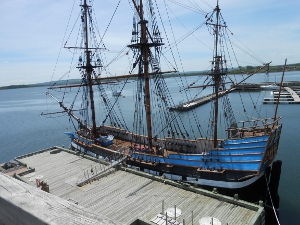 The three-masted wooden ship has a high stern