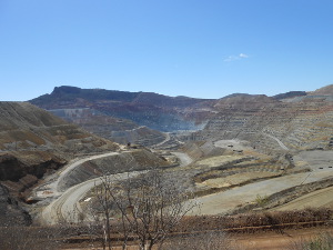 The pit stretches a mile or more in diameter, with roads for mine trucks snaking down the terraced sides.