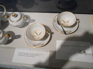 In the museum case are the very cups from which the queen drank her tea, with the tea stains still visible.