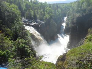 Two dynamic large waterfalls, one on each river converging into one at the base of the falls
