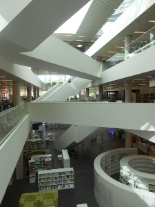 A geometrically arranged splash of white concrete walkways and staircases connect the floors of the new Halifax Public Library
