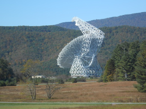 From a distance the telescope is a pure white tracery of framework and dish antenna with an overhanging edge to capture the reflected radio waves to the powerful receivers
