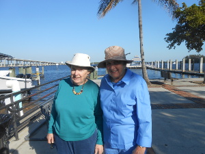 The two ladies are wearing blue with floppy wide-brimmed sunhats