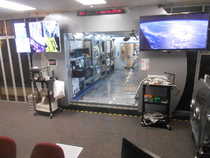 An exact model of a portion of the International Space Station used for performing science projects is replicated in the Payload Operations Center.