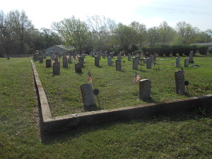 A large cemetery area is set off with the official headstones provided for Civil War veterans.