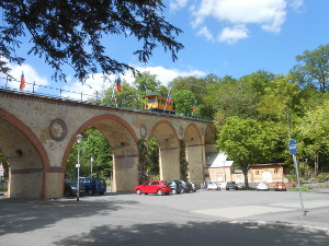 At the bottom of the hill, the funicular crosses a viaduct over the city street