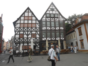Two beautiful tall half-timbered houses on a public square near the Kramerbrucke