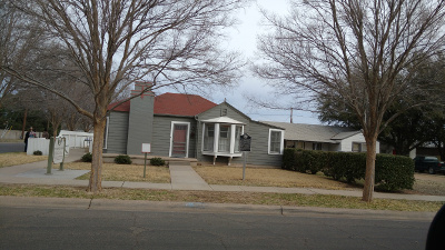 A small ranch style home in Midland, painted gray