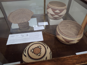 Made of carefully selected and shaped reeds of various plants grown in the area, these baskets are woven with triangular patterns in black, brown, and sand colors.