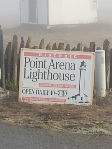 The sign declares that Point Arena Lighthouse is open daily from 10 to 3:30
