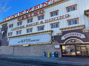 The upper two floors of this building are motel rooms, while the ground floor is the casino, decorated with a glittering entrance and a large marquis.