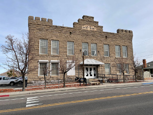 The stone courthouse stands on Goldfield's main thoroughfare.  Two stories tall, the large building stands alone - buildings to the left and right have come down.